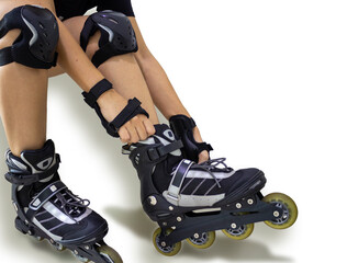 Adjusting roller to the feet, getting ready to go out. Knee pads and hand protection, extreme sport.