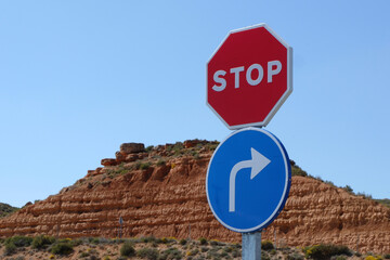 Road signs Stop and Turn right on the highway in Spain. Madrid - Barcelona transport route