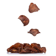 Falling flying meat chips isolated on white background. A serving of meat chips.
