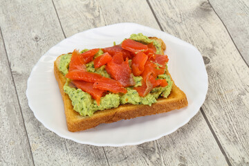 Toast with guacamole and salmon