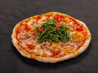 Pizza with bacon and rucola