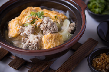 Thai Omelette Soup with Minced Pork and Vegetables in Brown Ceramic Cup