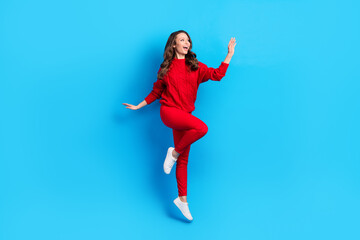 Fototapeta na wymiar Full body profile side photo of young girl happy positive smile jump up isolated over blue color background