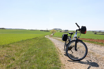 Fototapeta na wymiar Spring landscape with an e-bike on the way