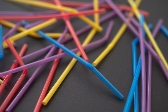 close up of drinking straw on black background