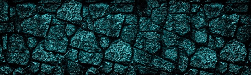 Bright teal stone wall wide texture. Dark turquoise rock tile masonry panoramic background