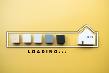 Stylized loading bar by wood block to wooden home