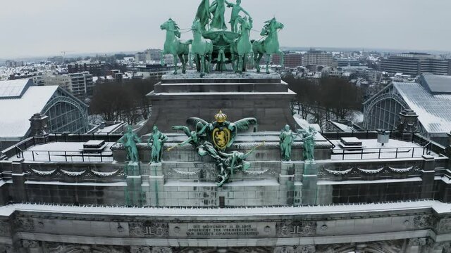 Aerial view of Arc du Cinquantenaire, a stately triple arch monument in wintertime, Brussel, Belgium.