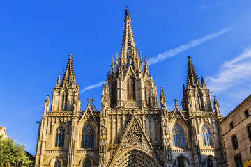 Fototapeta na wymiar Architectural fragments of Barcelona Cathedral (1298) - Gothic Basilica La Catedral de la Santa Creu i Santa Eulalia at sunset. Gothic Quarter, Barcelona, Spain.