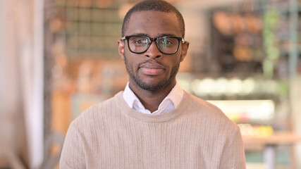 Portrait of Serious African Man Looking at Camera 