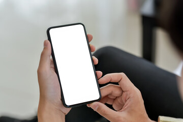 Image of a businessman with a smartphone blank white screen sitting at the office