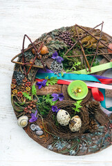 Wiccan altar for Beltane sabbath. spring pagan festive ritual. wheel of the year with colorful...