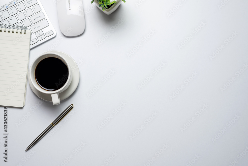 Poster white flat floor with mouse notebook coffee desk top view. copy space.