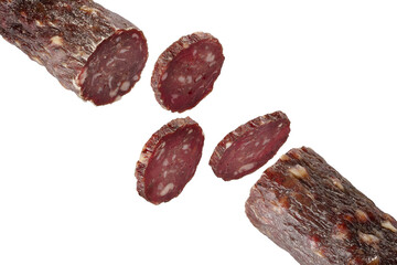 Dry meat sausage cutaway isolated on white background. Thin rings of delicious sausage.
