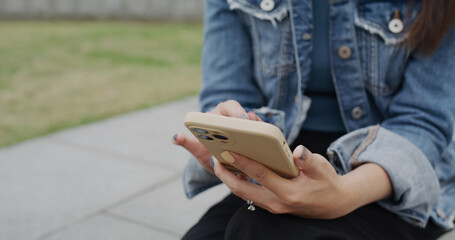 Woman use of mobile phone at outdoor