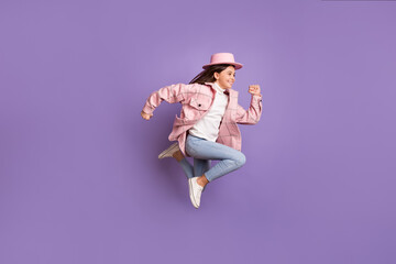 Profile photo of little lady jump run empty space wear pink hat plaid jacket jeans shoes isolated violet color background