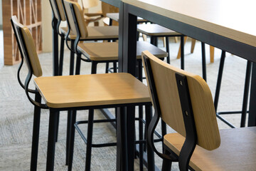 The public room area has a lot of chairs and tables where no people