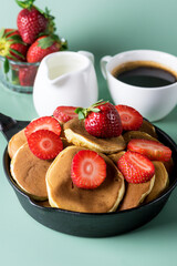 Homemade Small Pancakes with Strawberry Served in Pan Yellow Background Fresh Pancakes and Cup of Coffee Tasty Breakfast Vertical