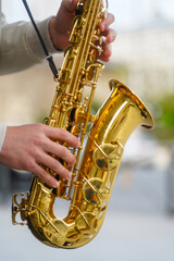 Obraz premium saxophone. saxophone detail in the center of Bucharest, Romania. wind instrument. photo during the day.