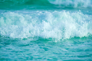 Turquoise Water ocean waves and white sand in the Gulf of Mexico