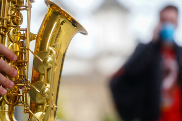 saxophone. saxophone detail in the center of Bucharest, Romania. wind instrument. photo during the...