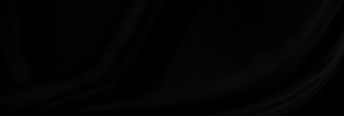 Black gray satin dark fabric texture luxurious shiny that is abstract silk cloth panorama background with patterns soft waves blur beautiful.