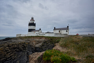 Fototapeta na wymiar Hook Lighthouse landscape and peninsula Heritage center in Wexford, Ireland.