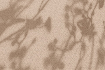 Abstract flower shadows on light brown color wall texture background.