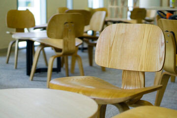 The public room area has a lot of chairs and tables where no people