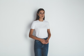 Successful young woman in jeans and blank white t-shirt