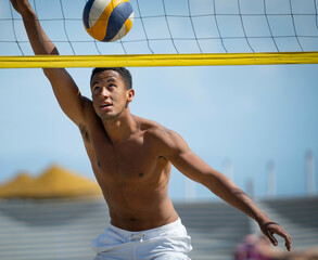 young men playing beach volleyball on a sunny day