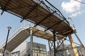 Fototapeta premium former industrial zone foot bridge (truss design) over railway tracks and sky