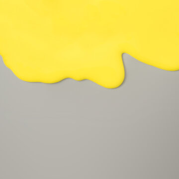 Abstract Yellow Oil Paint Texture On Grey Canvas. Minimal Background With Copy Space. Flat Lay.