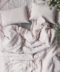 photo of beautiful ecological and natural linen bedding pastel colour with sheet, two pillows and large duvet cover