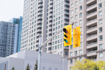 Yellow Traffic Light on a sunny on a suuny day in Toronto Ontario Canada	