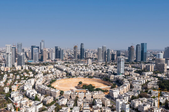 Tel Aviv skyline over Kikar Hamedina square with business district skyscrapers in the horizon, Aerial view.