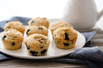 Side view of freshly baked gluten-free dairy-free blueberry muffins.