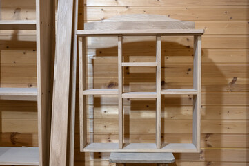 the cabinet is handmade from natural wood in light colors. Furniture manufacturing