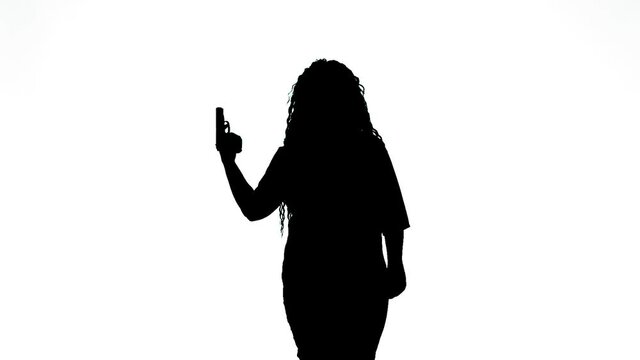 Silhouette of a woman with a pistol at a temple on a white background. Medium plan