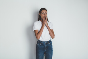 Front view of young woman in jeans and blank white t-shirt