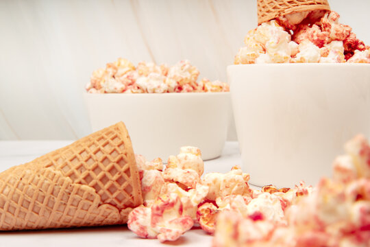 Ceramic bowl with pink strawberry popcorn and cream