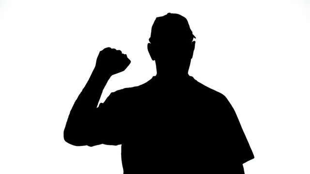 Silhouette of a man on a white background protests gesturing with his hands. Medium plan