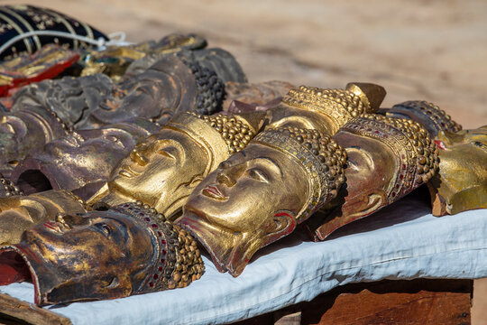 Handmade image of Buddha face and other souvenir in a tourist stall on street market near Inle Lake in Burma, Myanmar