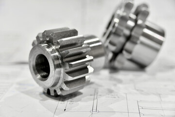 A cogwheel made on a gear cutting machine lies on the technical