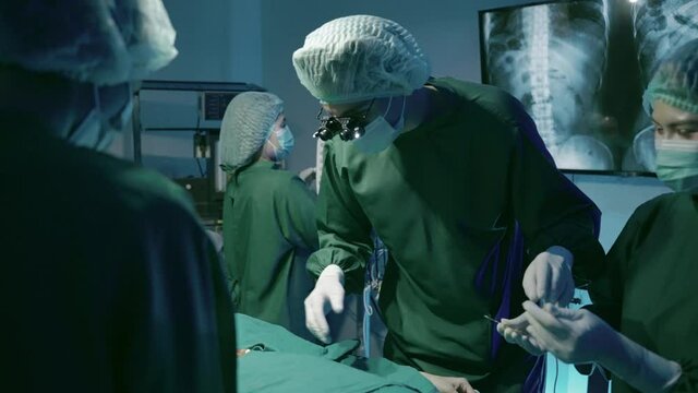 medical team is helping patients in the operating room in a hospital or clinic.
