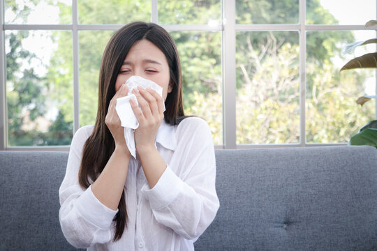 Beautiful Woman Long Hair Asian Sick Coughing Or Sneezing Cover Your Mouth And Nose With Tissue Paper. Concept Of Health Treatment Prevent Transmission Of Virus