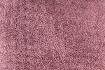 Plum colour velour textile sample. Fabric texture background