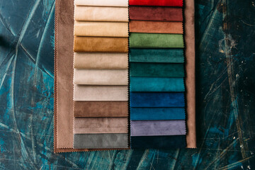 Collection of colorful velour textile samples. Fabric designed for sofas and armchairs. Fabric texture background
