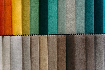 Collection of colorful velour textile samples. Fabric designed for sofas and armchairs. Fabric...