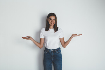 Front view of young woman in jeans and blank white t-shirt